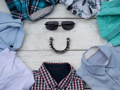 Flat lay, top view, men fashion casual clothing set isolated on white wooden  Stock Photos