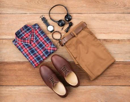 Flat lay, top view, men fashion casual clothing set on wooden background incl Stock Photos