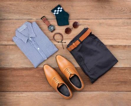 Flat lay, top view, men fashion casual clothing set on wooden background incl Stock Photos
