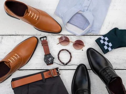 Flat lay, top view, men fashion casual clothing set on white wooden backgroun Stock Photos