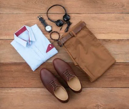 Flat lay, top view, men fashion casual clothing set on wooden background incl Stock Photos