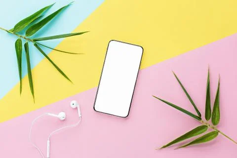 Flat lay top view mockup photo of working space with smartphone, headphones a Stock Photos