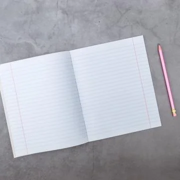 Flat lay, top view, notebook, pencil on a gray textured background. Stock Photos