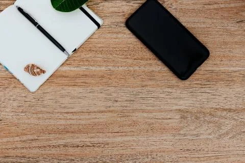 Flat lay, top view of a notepad with white paper and pen for planning Stock Photos