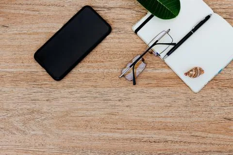 Flat lay, top view of a notepad with white paper and pen for planning Stock Photos