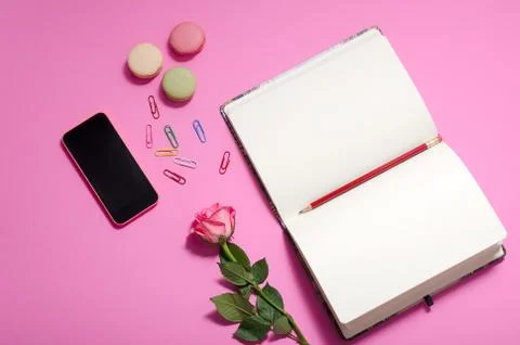 Flat lay, top view office table desk. feminine desk workspace with roses Stock Photos