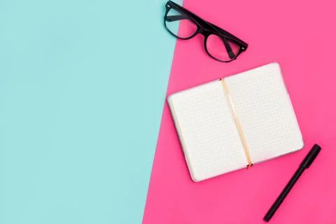 Flat lay, top view office table desk. Work space with open Notepad, glasses a Stock Photos