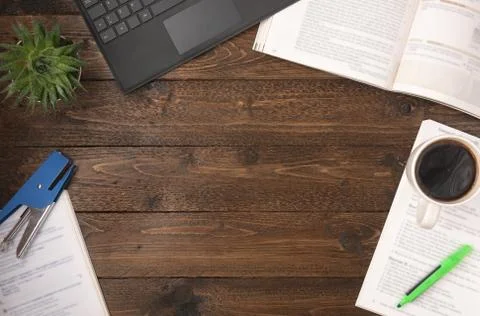Flat lay, top view office table desk. Workspace with open books, laptop, offi Stock Photos