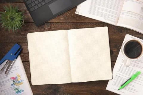 Flat lay, top view office table desk. Workspace with open books, laptop, offi Stock Photos