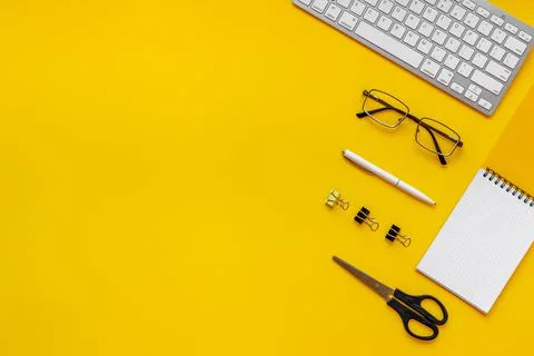 Flat lay top view office table - desk with supplies and keyboard Stock Photos