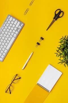 Flat lay top view office table - desk with supplies and keyboard Stock Photos