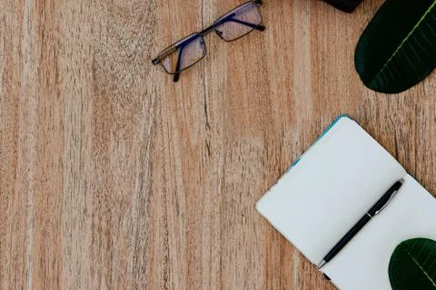 Flat lay, top view of an open white notebook with pen for writing cases Stock Photos
