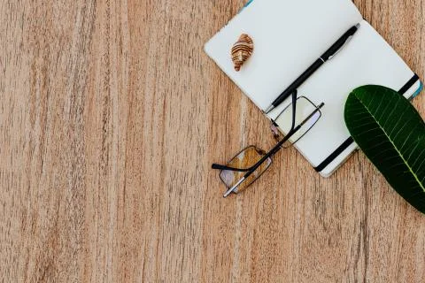 Flat lay, top view of an open white notebook with pen for writing cases Stock Photos