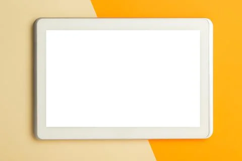 Flat lay, top view of orange office table desk with tablet computer screen .. Stock Photos