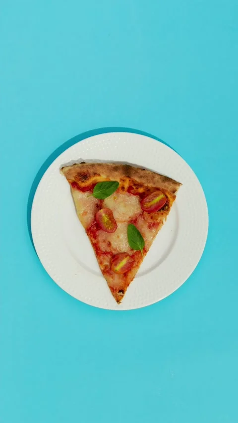 Flat Lay Top View Pizza Cut on Plate moving on Blue Table Stop Motion Animation Stock Footage 155781840