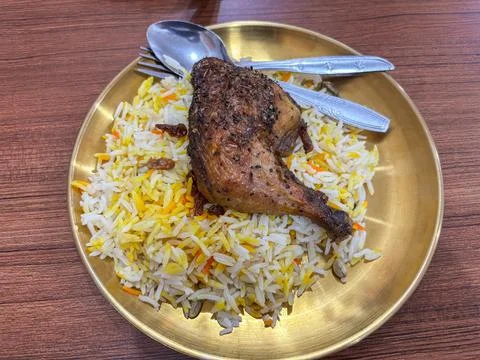 Flat Lay Top View of Traditional Kabuli Rice with Raisins on Plate Stock Photos