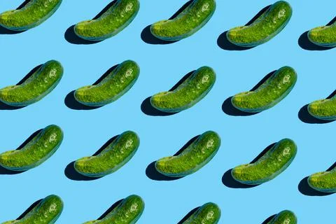 Flat lay of trendy seamless pattern cucumbers. Pattern of green cucumbers on Stock Photos