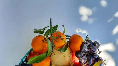 Flat lay, Tropical fruit Oranges, pears and grapes on white background Stock Photos