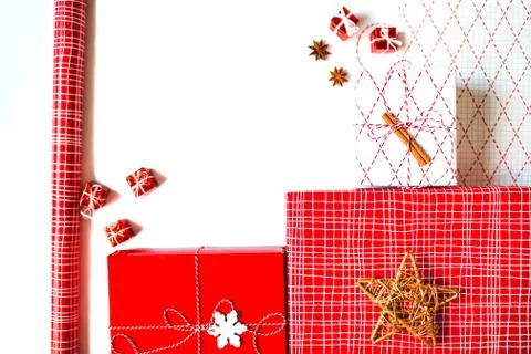 Flat lay with two gift boxes and wrapping paper isolated on white background. Stock Photos