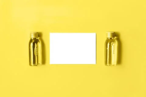 Flat lay of two small mockup bottles with spa cosmetic products toned in tren Stock Photos