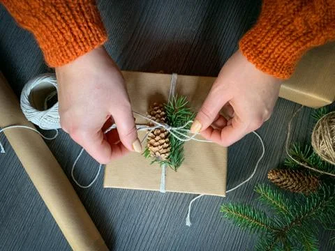 Flat lay of unready hands crafted gift box on rustic wooden table Stock Photos