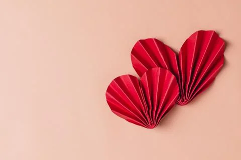 Flat lay valentine background with folded paper heart and gift box Stock Photos
