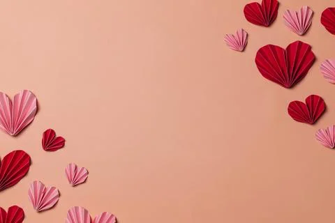 Flat lay valentine background with folded paper heart Stock Photos