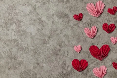 Flat lay valentine background with folded paper heart and gift box Stock Photos