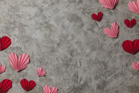 Flat lay valentine background with folded paper heart and gift box Stock Photos