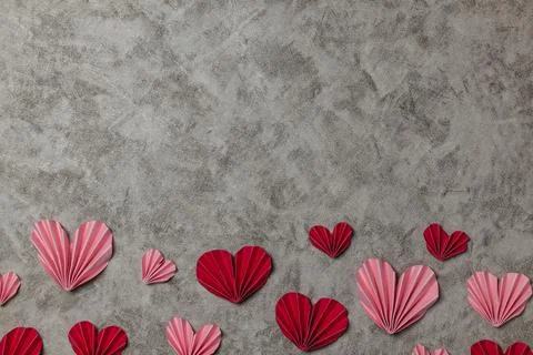 Flat lay valentine background with folded paper heart and gift box Stock Photos