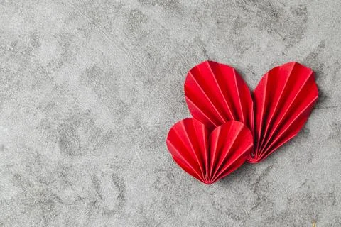 Flat lay valentine background with folded paper heart and gift box Stock Photos