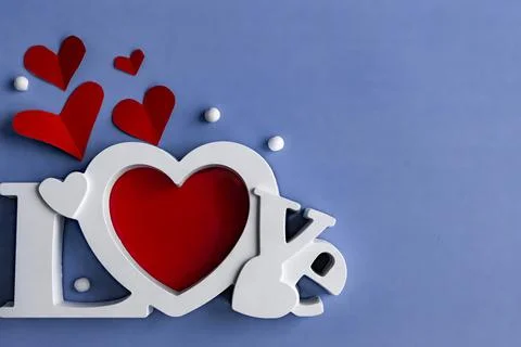 Flat lay valentine's day composition, big letters "Love" and red hearts Stock Photos