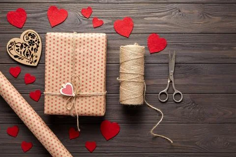 Flat lay on Valentine's Day or a birthday with gifts, scissors, wrapping paper Stock Photos