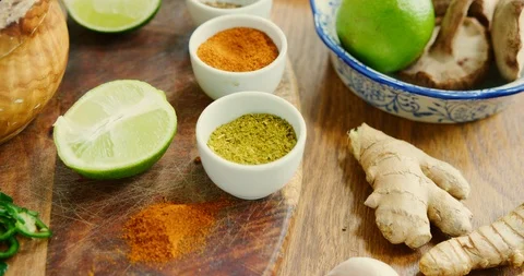 Flat Lay Of Various Fresh Spices On Chopping Board And Kitchen Counter 4K Stock Footage 92101362
