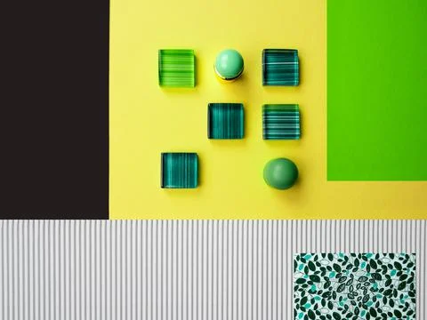 Flat lay various geometric paper shape,glass mosaic,green stone ball,copy space Stock Photos