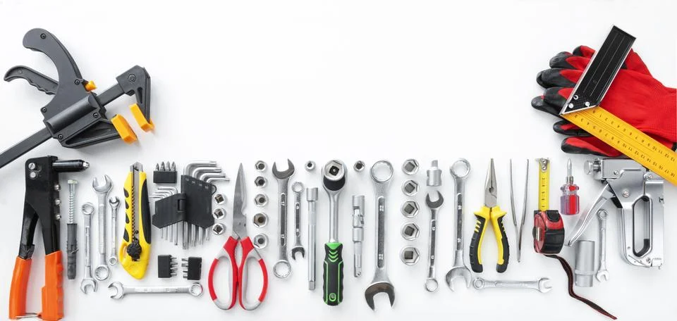 Flat lay of various hand tools and equipment on white background Stock Photos