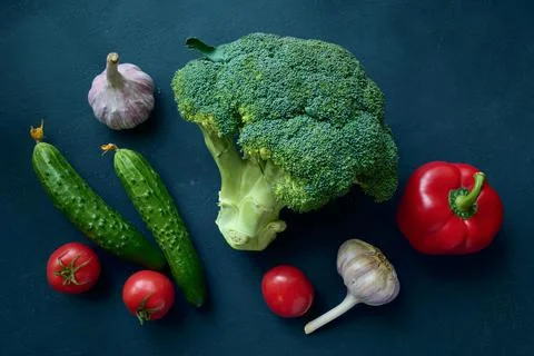 Flat lay vegetables on a blue background close up Stock Photos