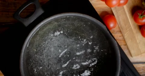 Flat lay video of boiling water in the pot Stock Footage 232593877