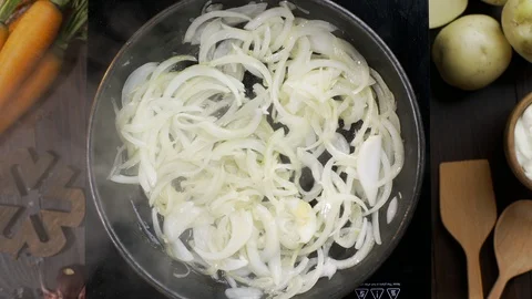 Flat lay video: chef adds chopped carrot to the onion on the hot pan and stirs Stock Footage 114958937