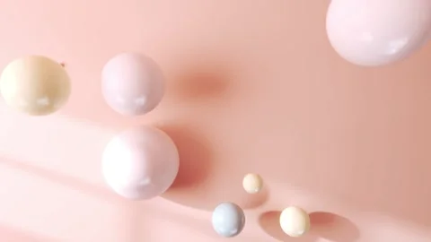 Flat lay view of balls falling down on a pastel background. Abstract 3D Stock Footage 230617541