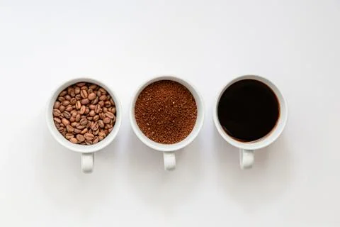 Flat lay view of, coffee beans, grinded coffe and ready to drink coffee in a  Fotos Stock