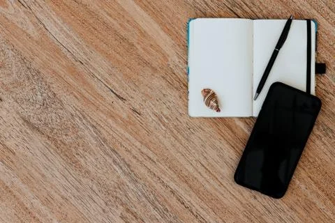 Flat lay, view of a notepad with white paper and pen for planning an upcoming Stock Photos