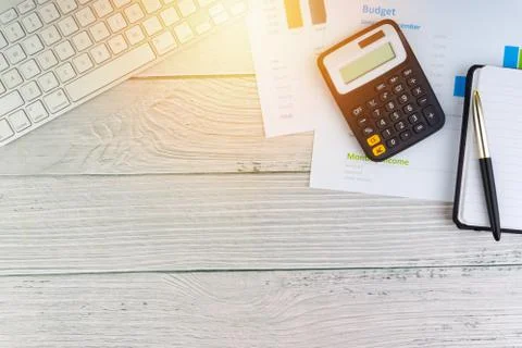 Flat lay view of office workspace with keyboard, pen, paperwork on wooden bac 写真素材