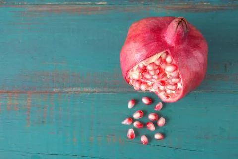 Flat lay view of one Pomegranate Fruit and seeds Stock Photos