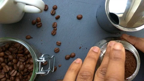 Flat lay view person preparing espresso coffee with a moka pot - 15 s Stock Footage 127868760