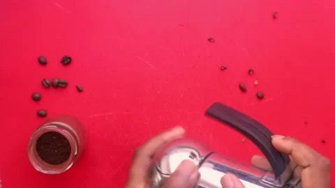 Flat lay view person preparing espresso coffee with a moka pot - 8 sec Stock Footage 130618938