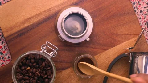 Flat lay view person preparing espresso coffee with a moka pot - 8 s Stock Footage 131493746