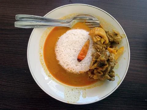 Flat lay view of A plate of rice with goat curry  Stock Photos