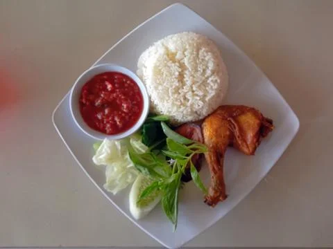 Flat lay view of plated fried chicken  Stock Photos