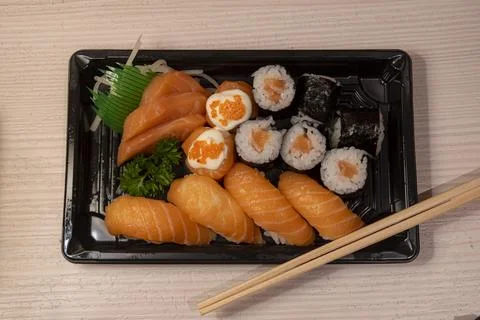 Flat lay view of a platter of various types of delicious sushi Stock Photos
